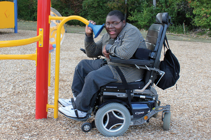 boy in wheelchair on playground