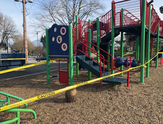 playground with caution tape around it