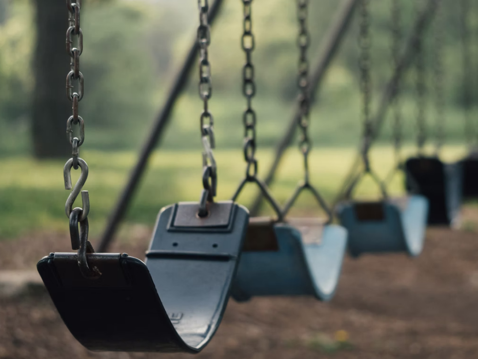 empty swings on playground