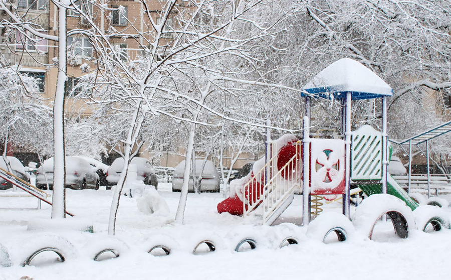 playground equipment covered in snow