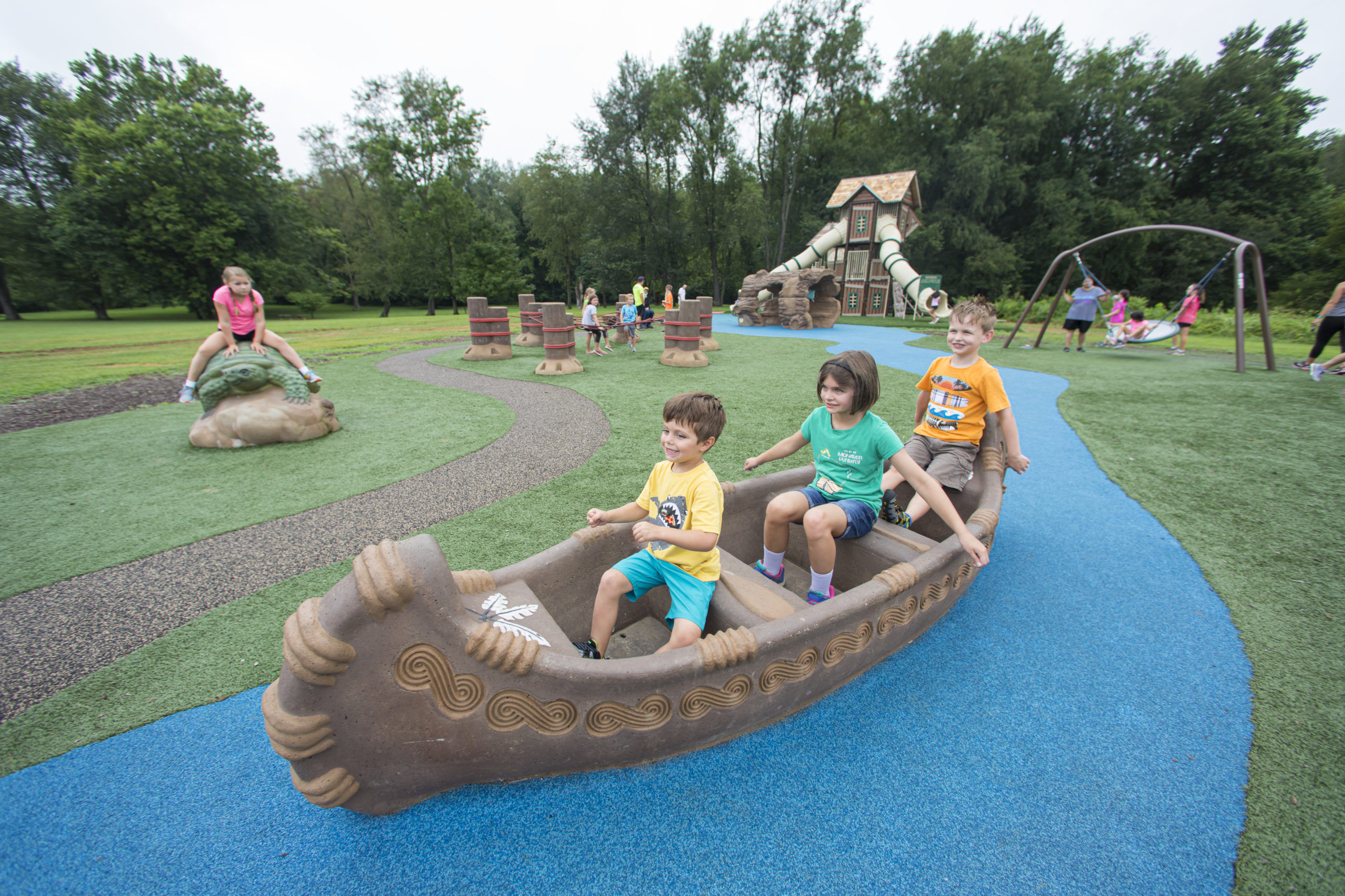 children playing on outdoors themed playground