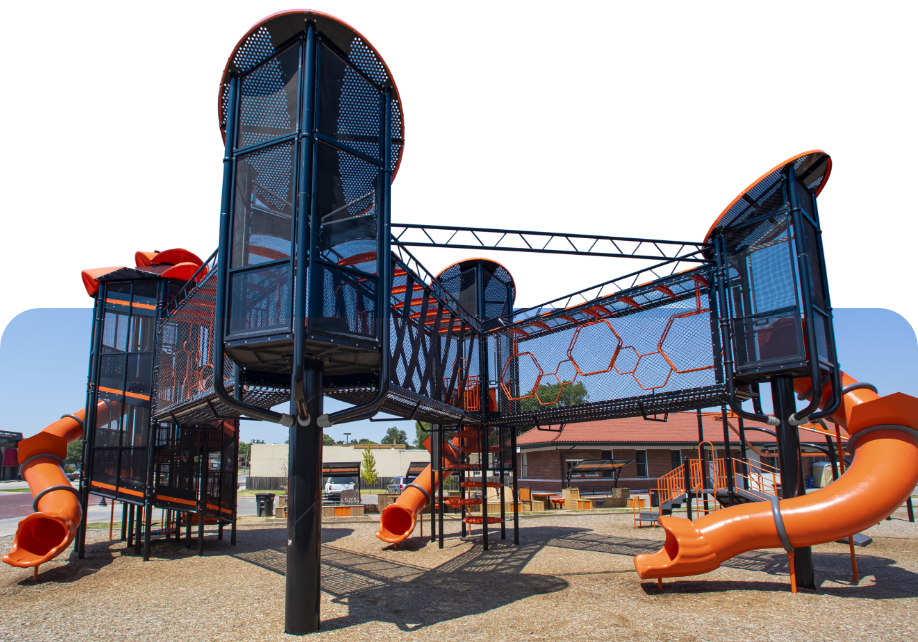 large playground with netted covered bridges for children to cross to reach slides