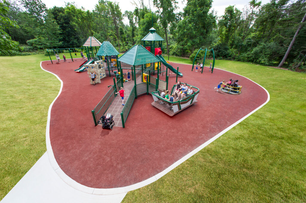 large inclusive playground installed on safety surfacing