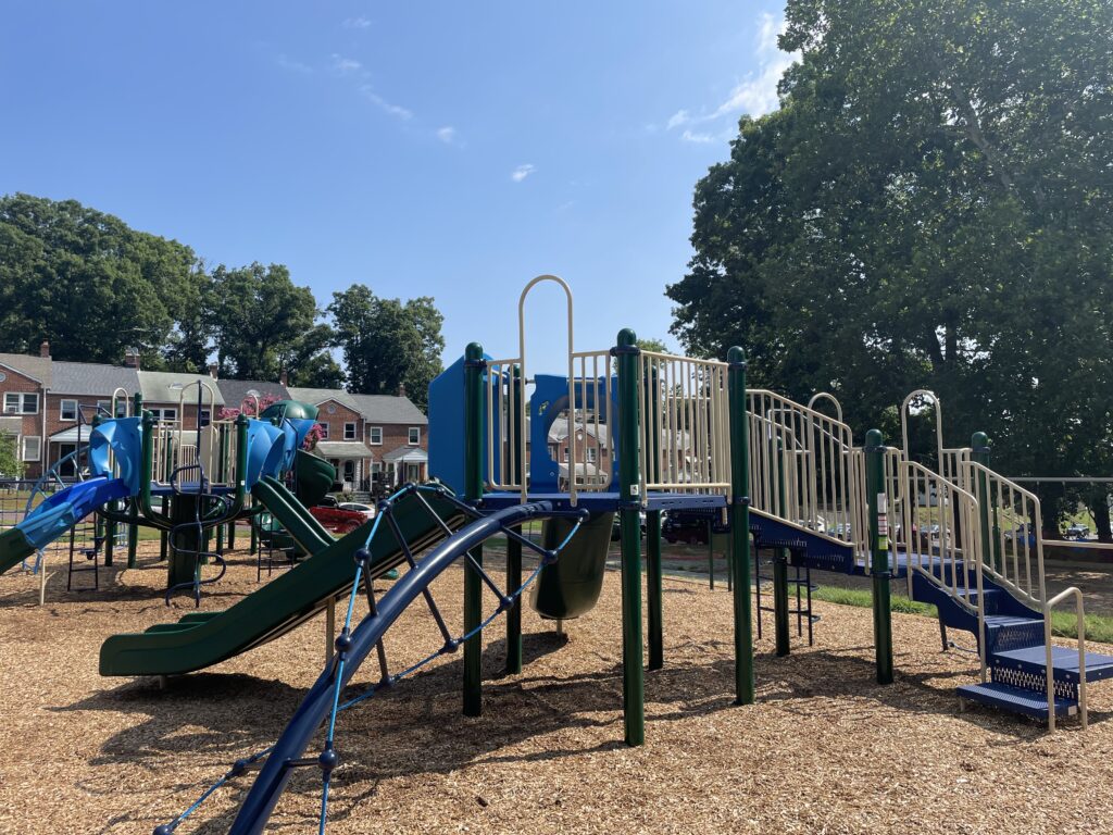 large community playground with multiple structures for children to play on