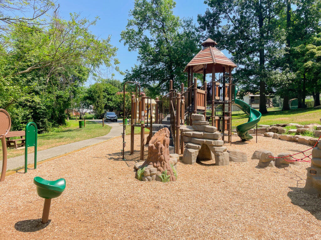 large playground designed to have a forest theme
