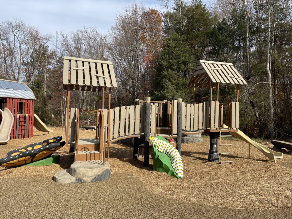 playground with a natural design featuring plastic bugs