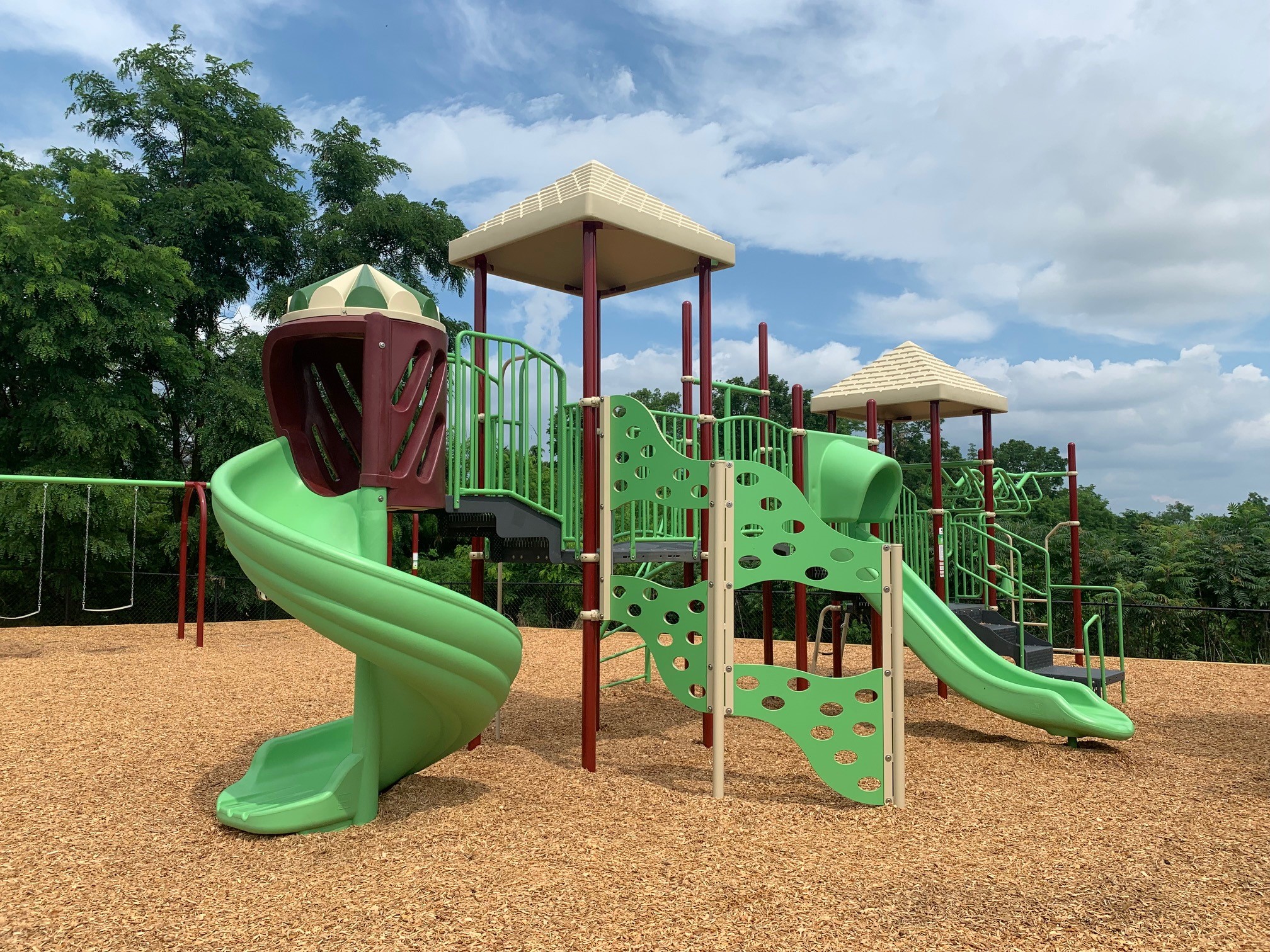 Bright green and brown playground equipment