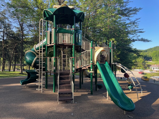 Green Playground with Slide in Shaded Area