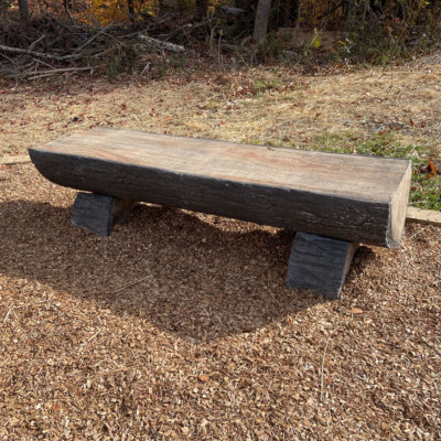 wood bench shaped like a log cut in half
