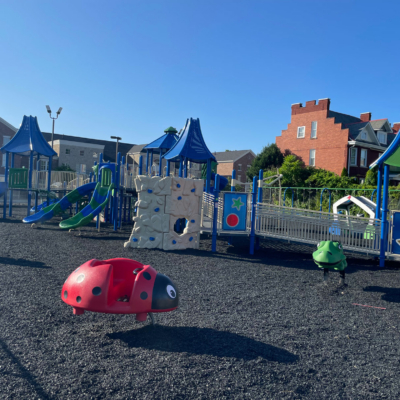 large playground with multiple slides and climbing structures